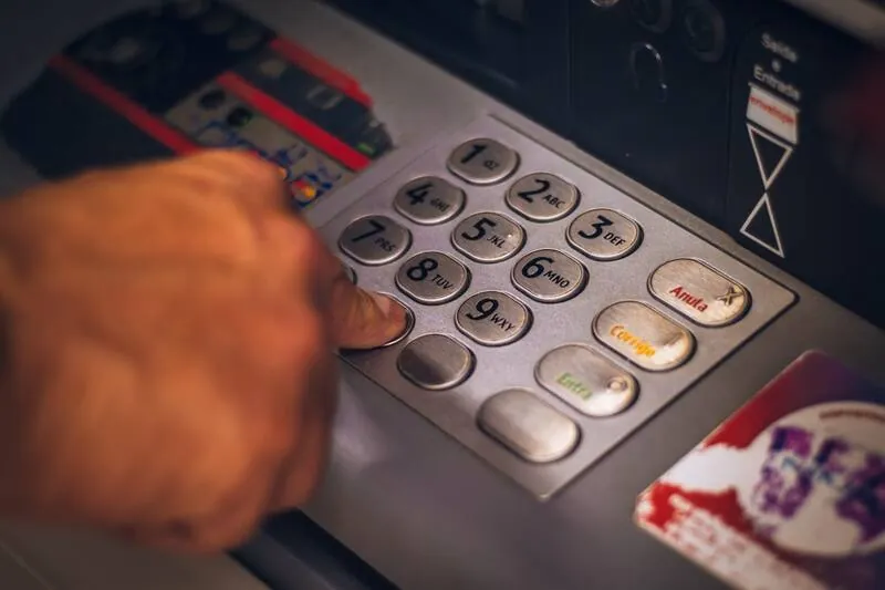 Technician at an ATM
